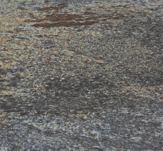 A soft stone slate with a rustic, weathered appearance, adding charm to any design project