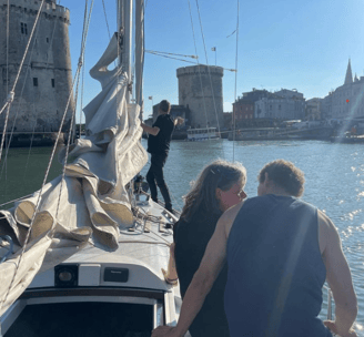 a man and woman sitting on a boat