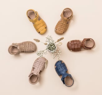 Product photography - a group of baby's shoes
