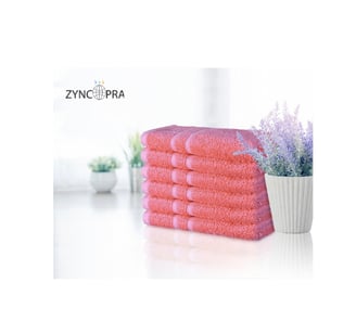 Luxury hotel towels in pink.