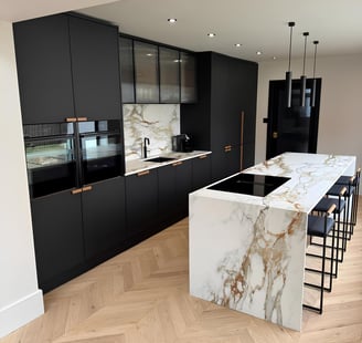 Modern porcelain kitchen island with waterfall edge and Calacatta veining, fitted  RH Stone Surfaces