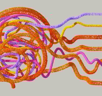 Colourful fibres making up the shape of a human head.