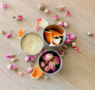 one bowl of dried orange peel one bowl of flour and a bowl of dried flowers