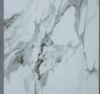 Calacatta sinoflexistone featuring a pristine white base with dramatic, flowing grey veining