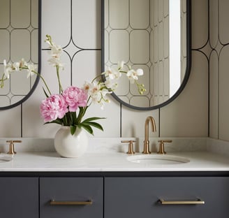 a bathroom with two sinks and two mirrors