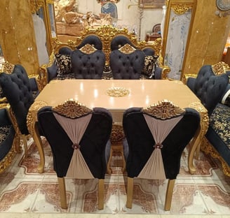 a dining room table with chairs and a table