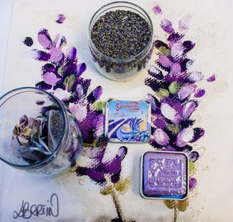 a table with a bowl of lavander seeds and a jar of dried herbs and a lavander soap in tin box