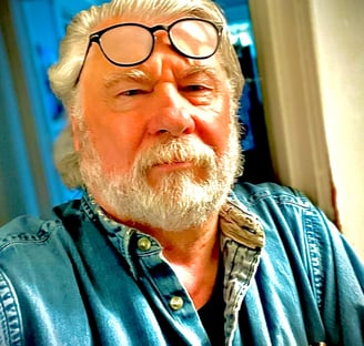 Headshot of Jude MacAllen Tatman