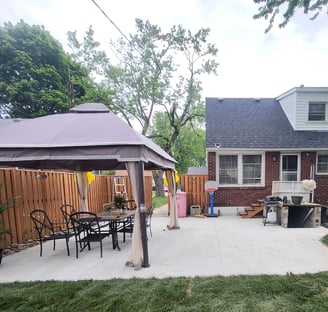 updated backyard with new concrete patio and fresh sod