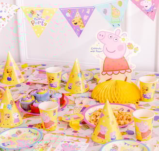 a table with a pep pep the pig party hat