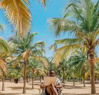 Kofi Dotse remotely working from Paps Beach in Keta Ghana