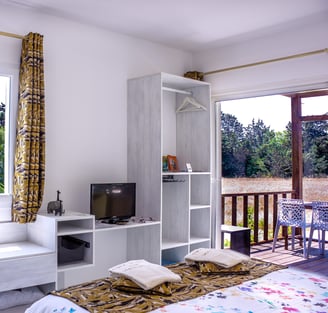 Bed with full bedding, floating bed with swimming pool view, olive grove view and garden at Domaine Des Lucques