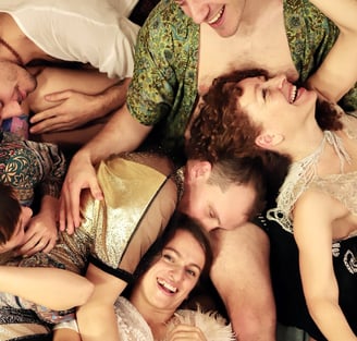 a group of people being in a cuddle puddle