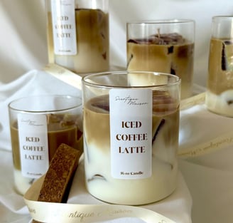 Luxury coffee and caramel candle with a ribbon around it with gold lettering