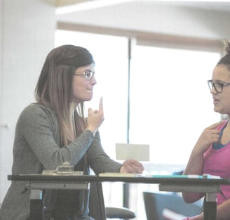 a speech and language pathologist with a client.