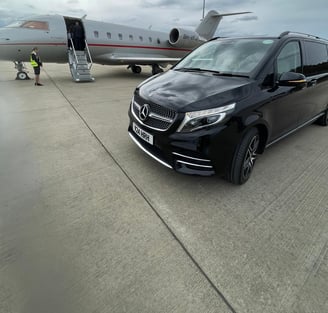 Private Jet Transfers. Mercedes V Class next to Vista Jet | Smart City Prestige