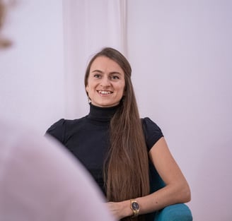 woman dressed in black smiling
