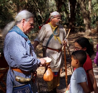 picture of Native Americans teaching children