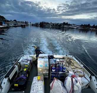 a boat with a lot of bags of food