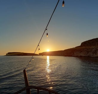 Esperienza in barca al tramonto, escursiopni Cutter Falco