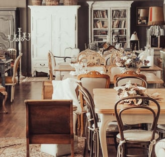 a room with a table and chairs and a table