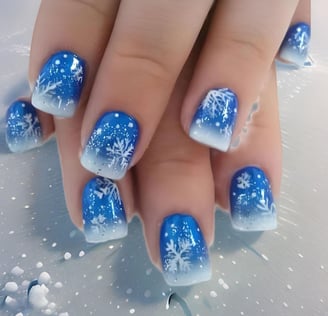 Uñas azules con copos de nieve