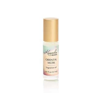 a bottle of oriental musk fragrance oil with a gold cap