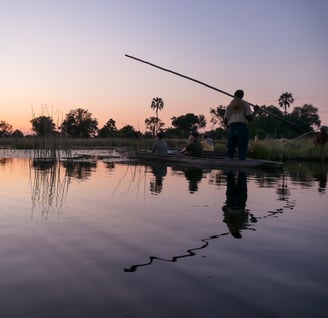 a man fishing on a boat in the water
