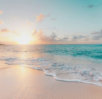 a beach scene with a sunset over the ocean in taipu de fora beach
