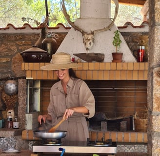 woman cooking traditional food in greek farmhouse