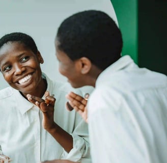 woman smiling in the mirror
