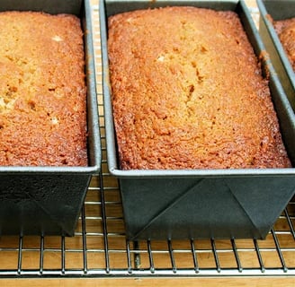 Loaves of pawpaw quick bread cooling on a rack