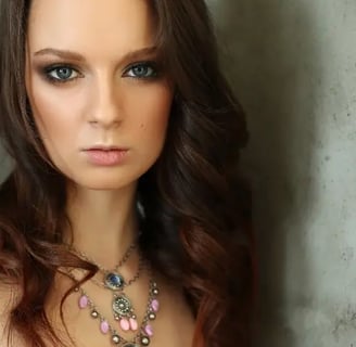 Elegant woman with sea stone necklace.