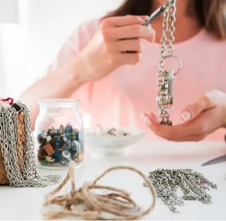 A Woman Perfecting Her New Jewelry Creation