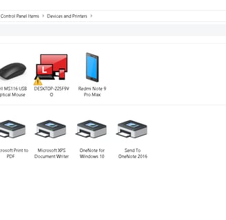 User accessing printer settings on a computer to change default printer settings.