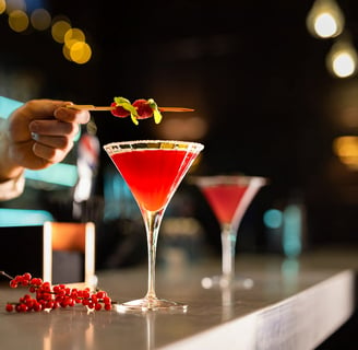 man making cocktail in a bar