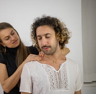 woman massaging mans shoulders