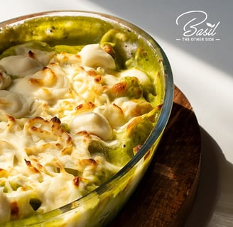 a dish of pasta with broccoli and cheese