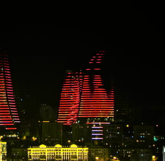 a city skyline with a lot of lights and buildings