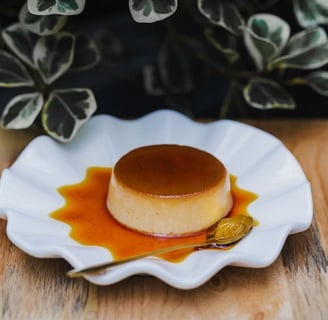 egg pudding with a golden-brown caramel layer, served in a round dish, highlighting its rich, smooth, and creamy appearance