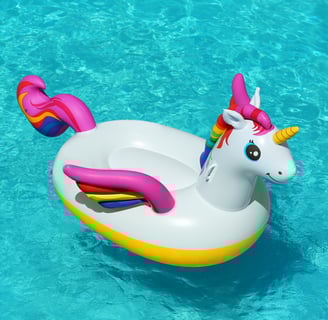 a unicorn floatie in the water with a rainbow - colored floatie