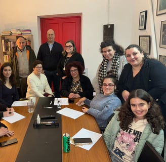 a group of people sitting around a table