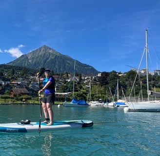 Corinne from Hidden Switzerland Travel Paddling in Spiez Bay