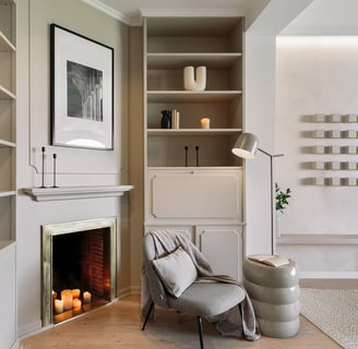 Living area with elegant decor, custom art, and calm beige tones, designed by SAVIA in Barcelona