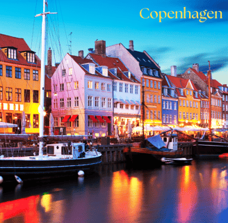 a boat in the water with a city of Copenhagen in the background
