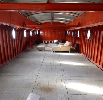 Empty Dutch barge with portholes