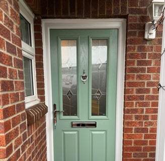 a new chartwell green l front door on red brick house installed by buildmydoor 