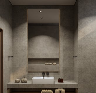 Modern bathroom featuring stone tiles and a large illuminated mirror.