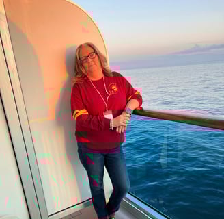 Shelly on a balcony of a Carnival Cruise to Alaska 