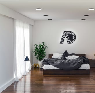 a bedroom with a bed and a lamp